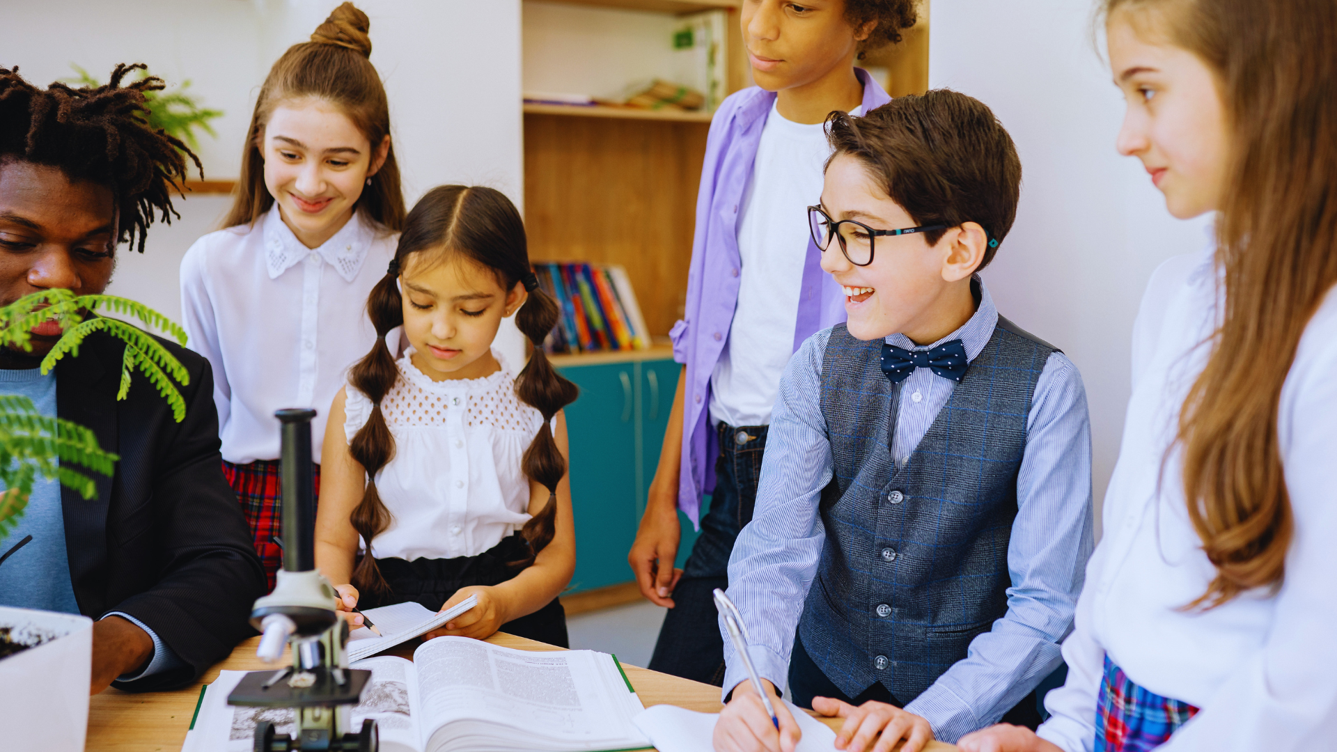 A diverse group of students collaborating on an experimental SEL project in a high-tech 2026 classroom environment.